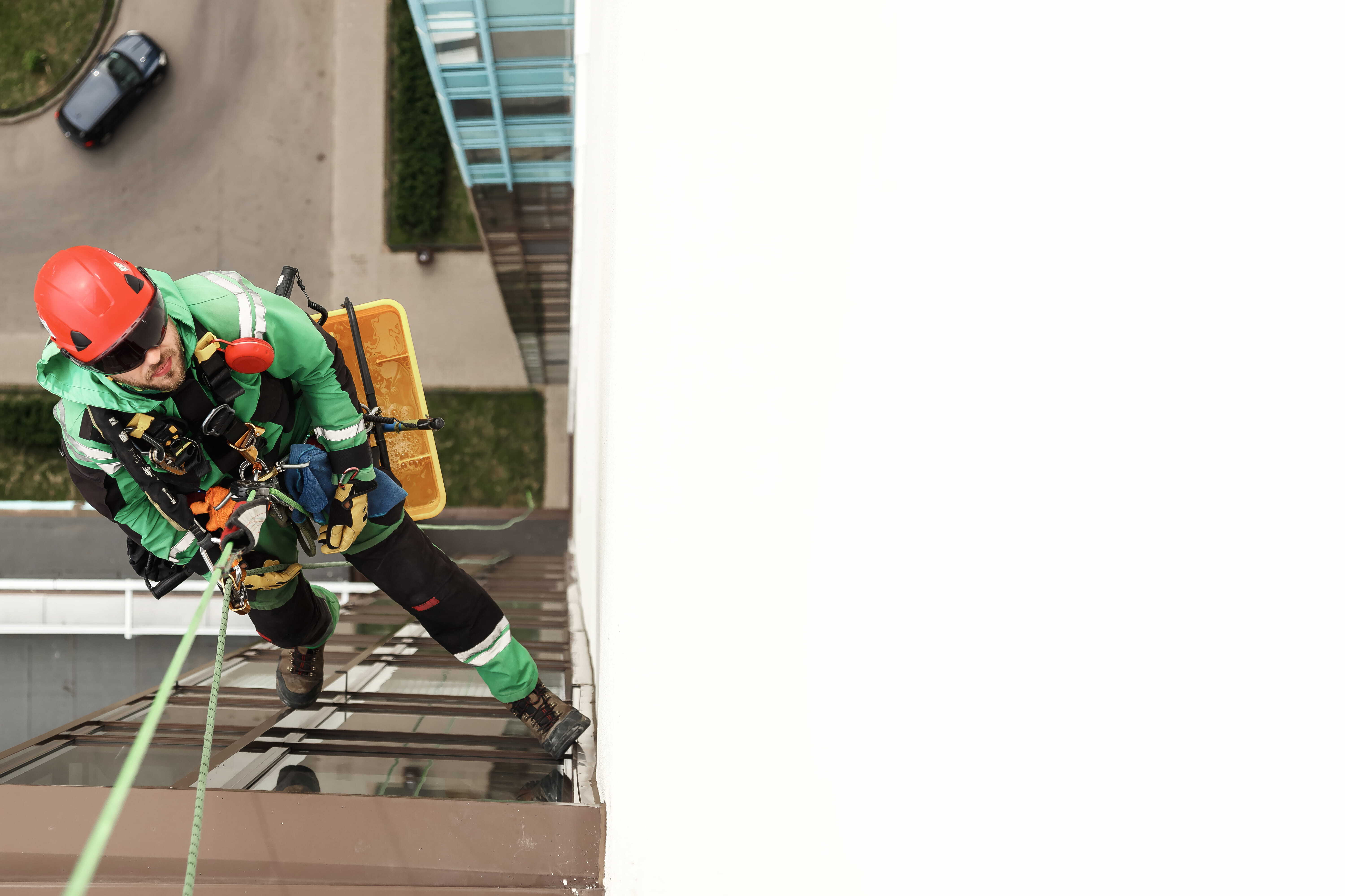 A male construction worker working at height using a safe working at height solution.